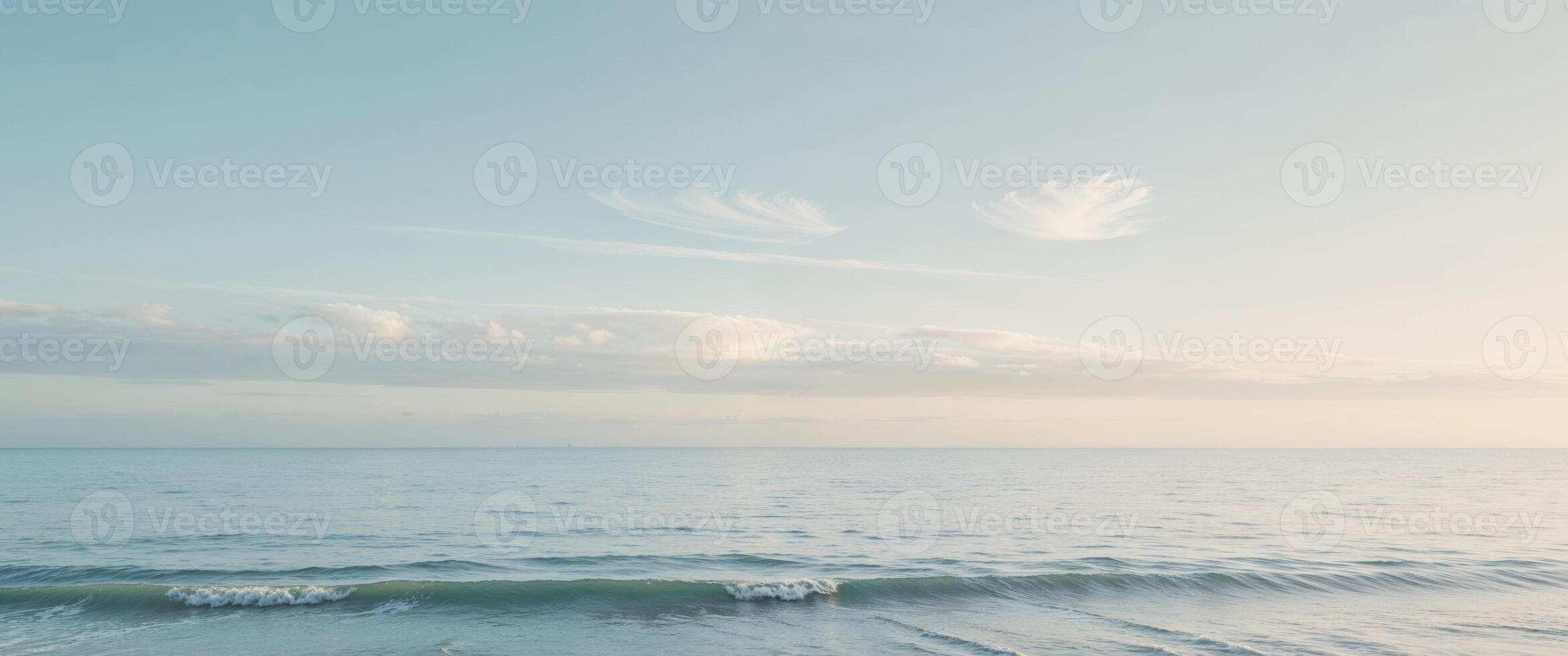 A person standing on the beach with a surfboard photo