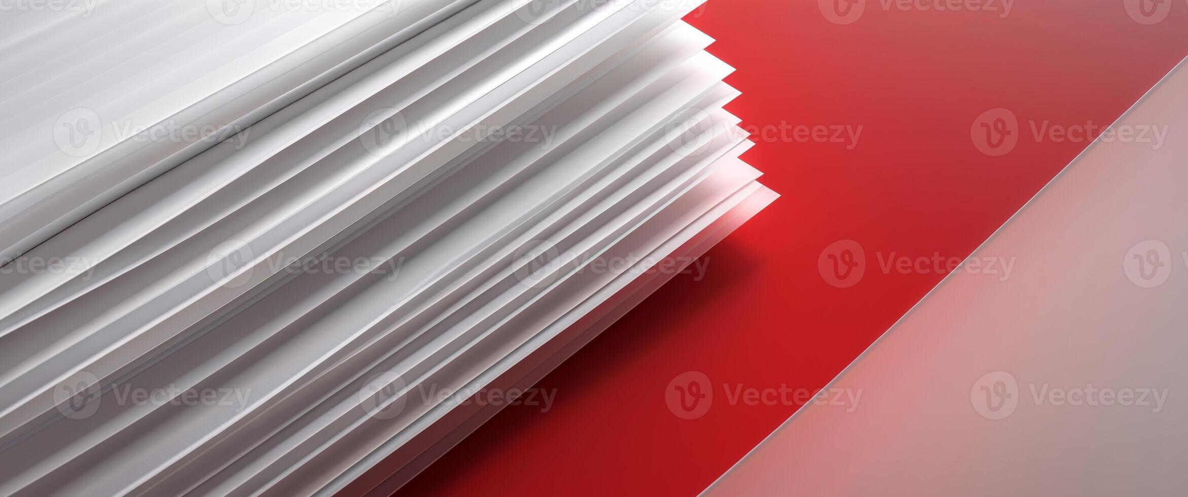 A stack of white papers on a red and white background photo