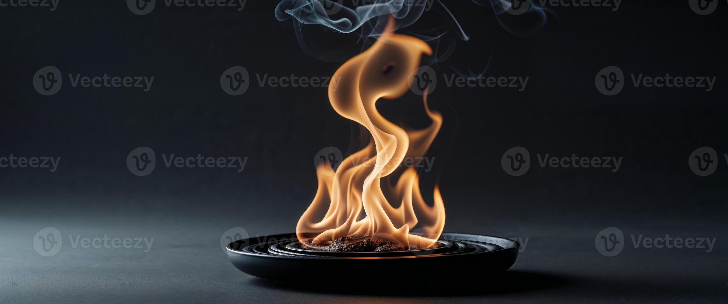 A somber reflective flame burning with a subtle glow that mourns. photo