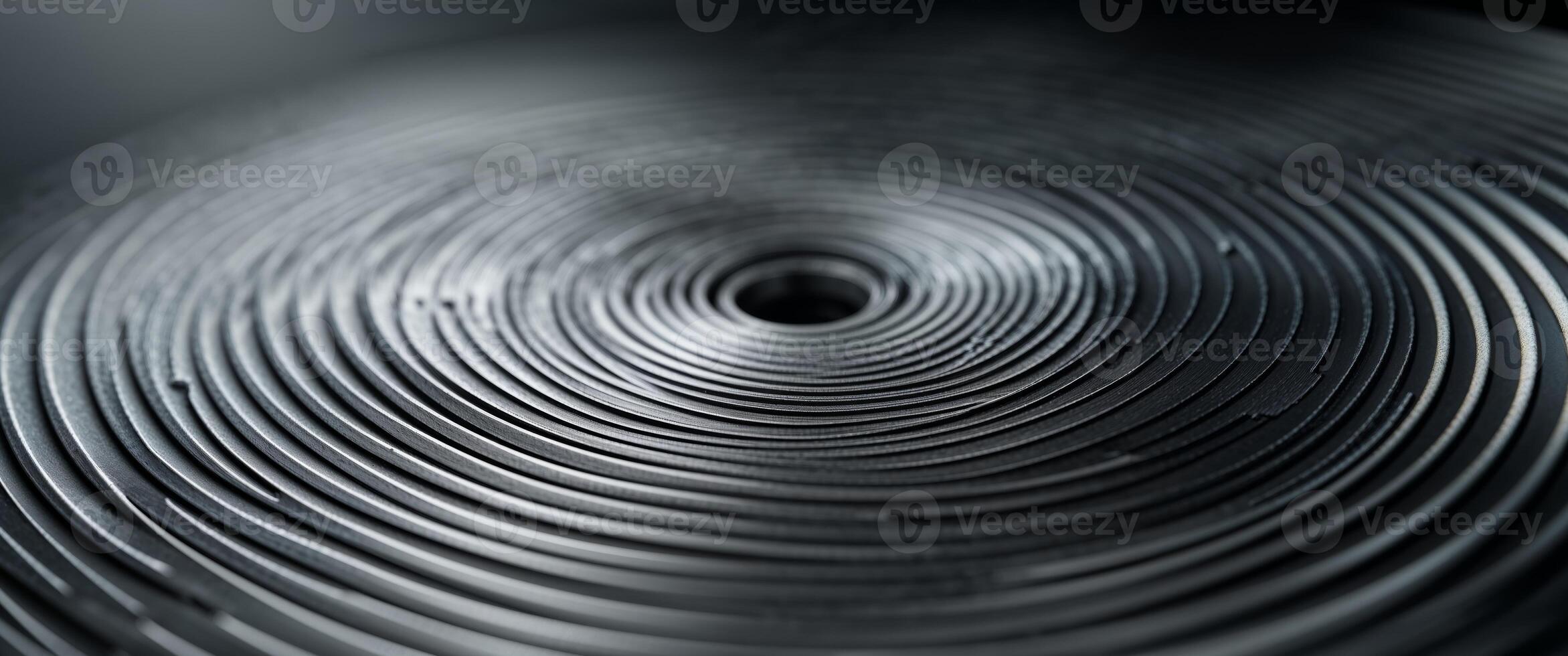 Circular brushed metal texture with radial lines creating a modern industrial background for design and technology applications showcasing metallic surface photo