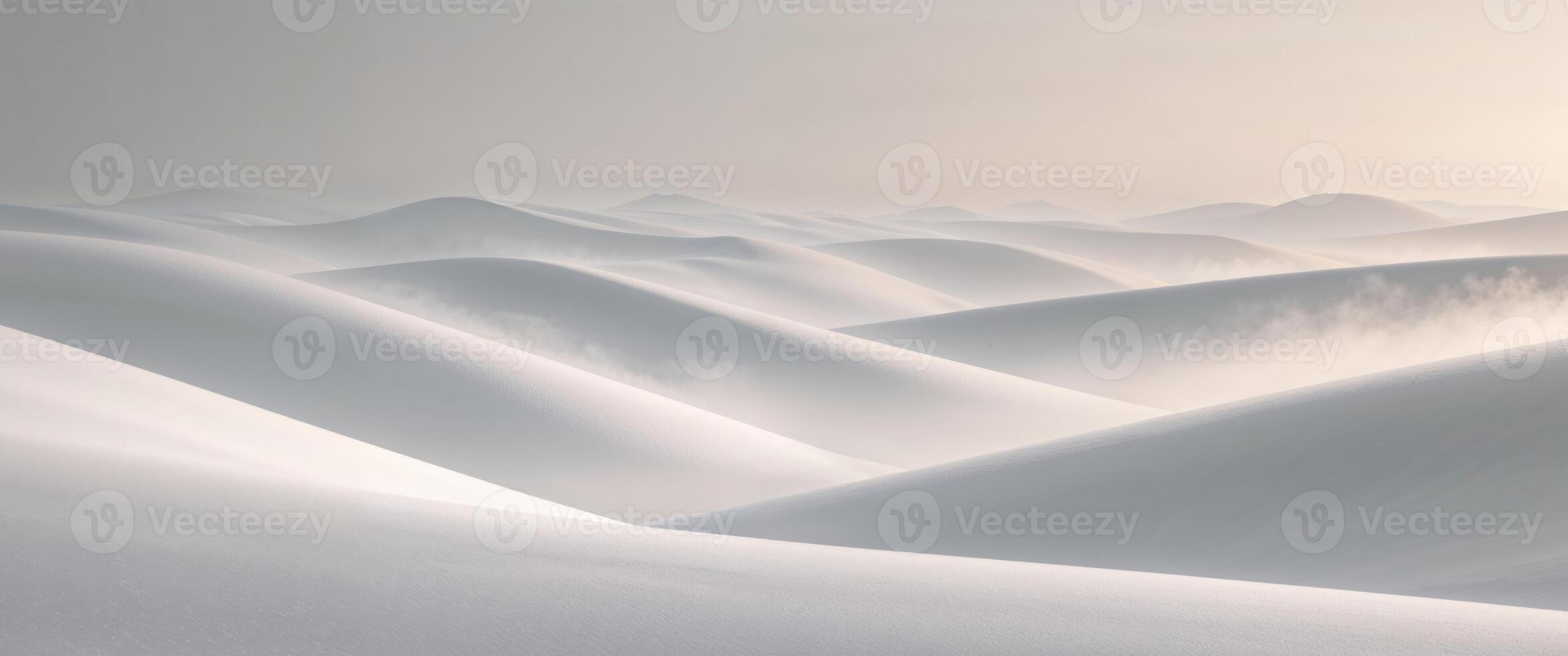 A snow covered mountain range with a sun shining photo