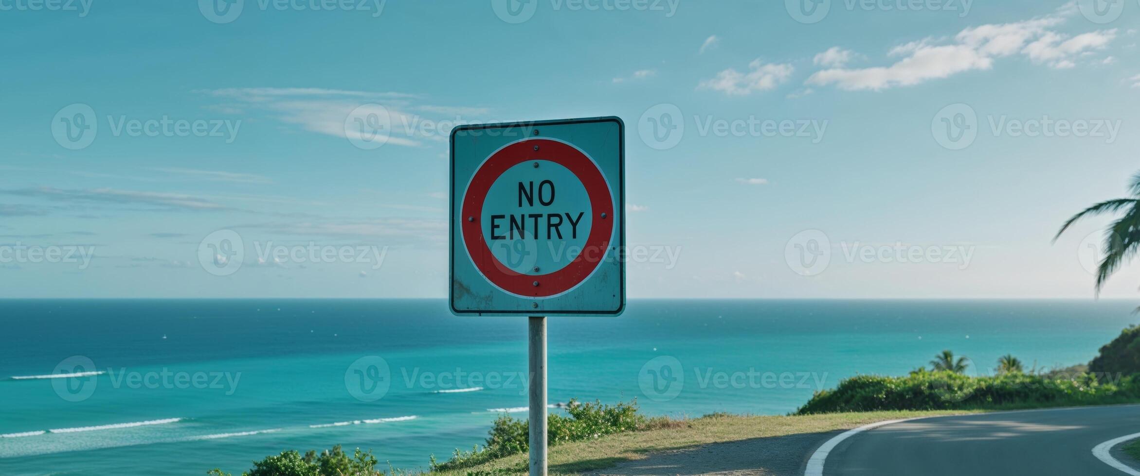 Scenic Road Stops at a No Entry Sign by the Ocean View. photo