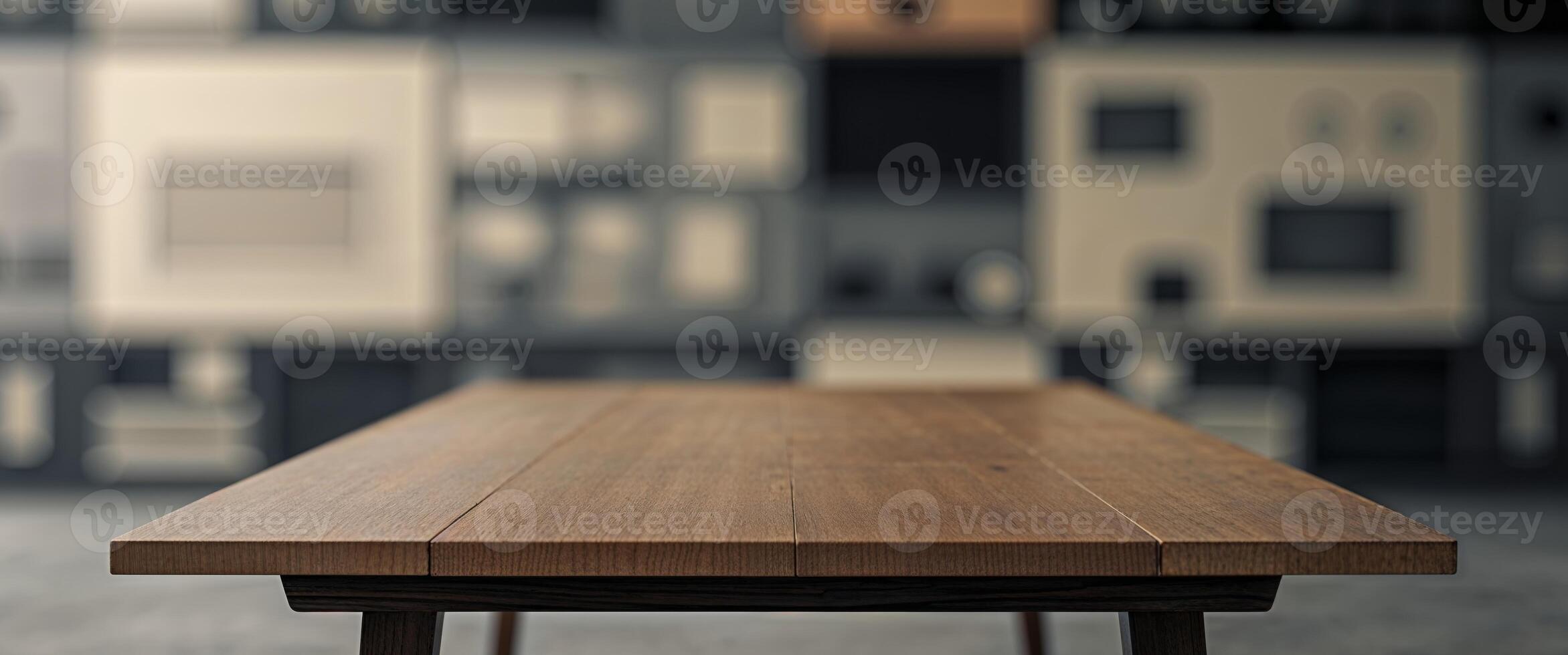 Empty wooden table in front of a blurred media wall. photo