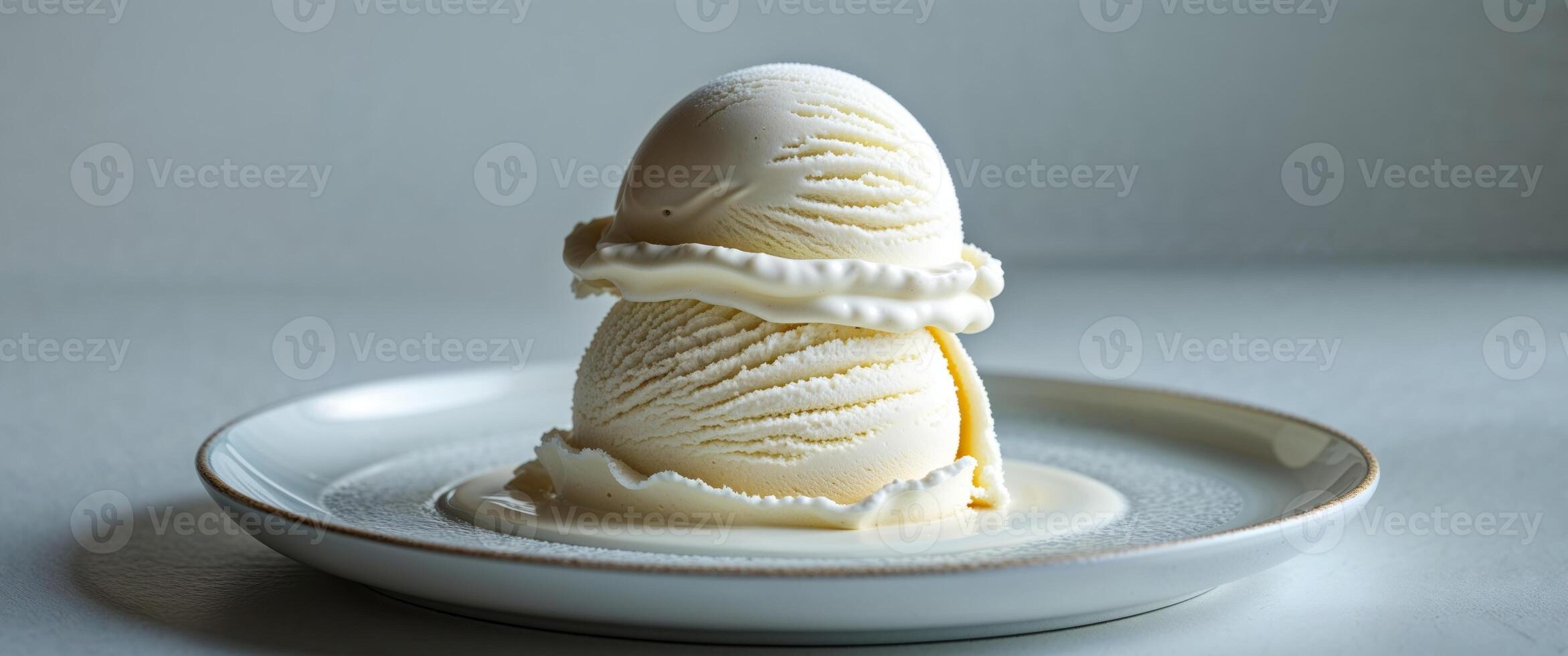 Scoop of Vanilla Ice Cream on a White Plate Dessert Treat. photo