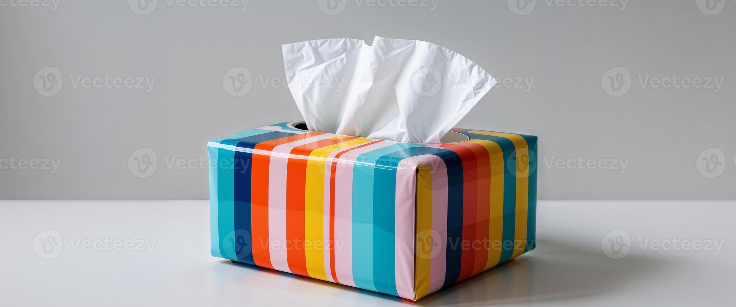 A tissue box with colorful stripes on it photo