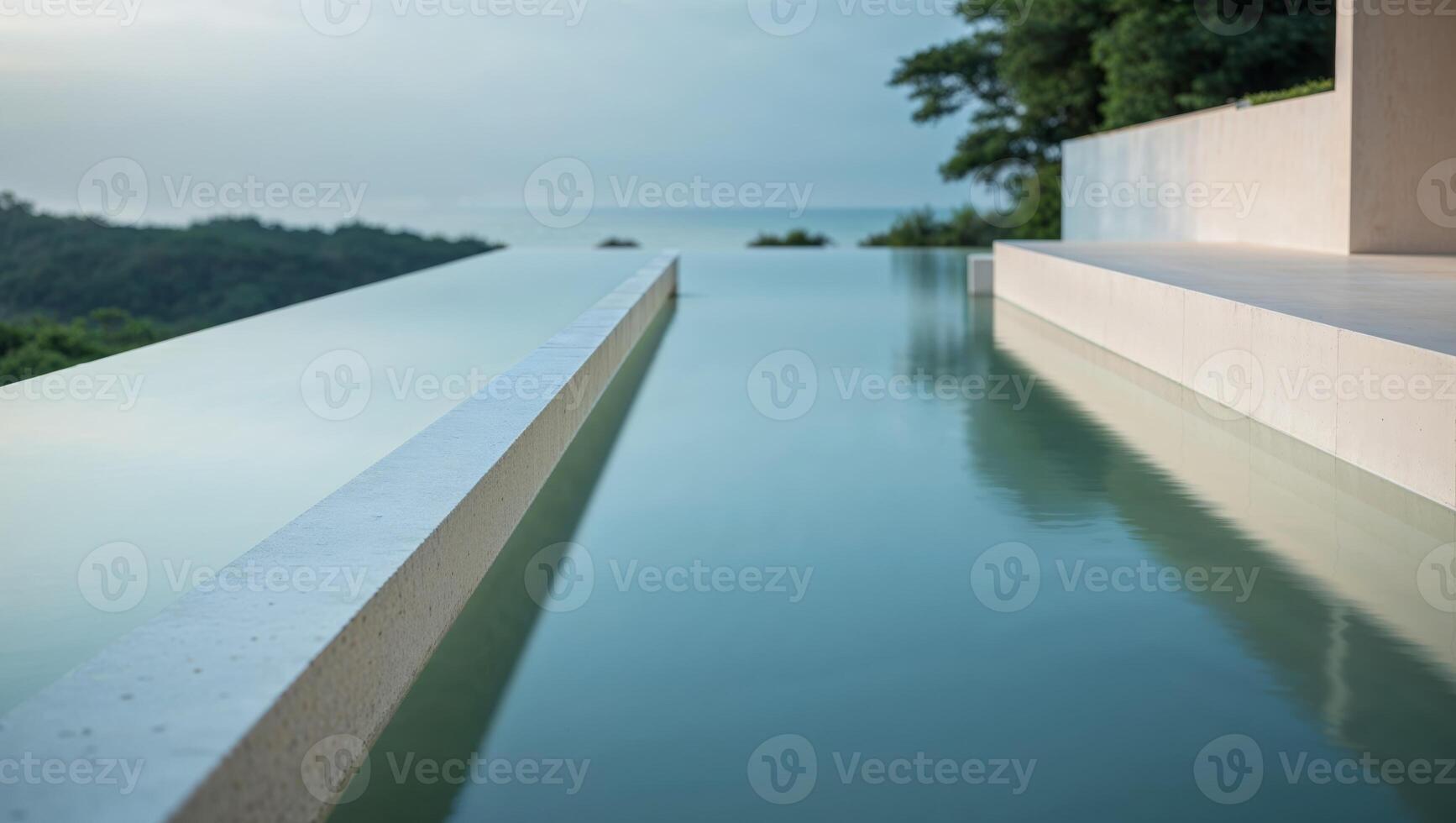 A long pool with a view of the ocean photo