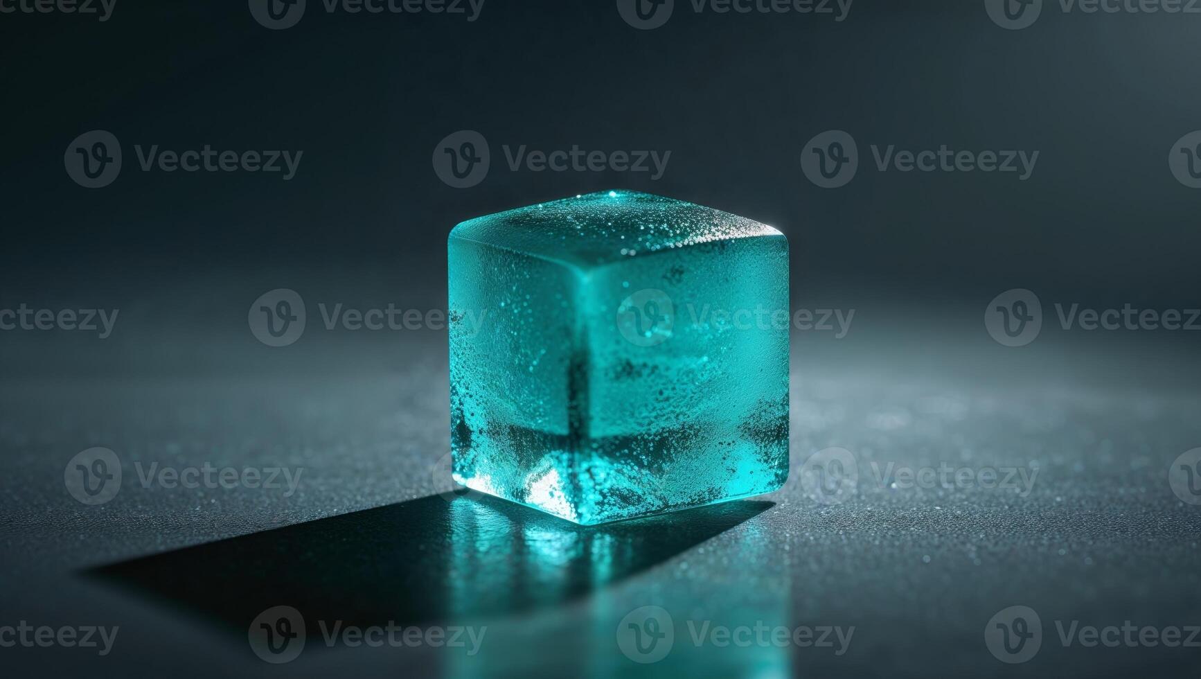 A blue ice cube sitting on a table photo