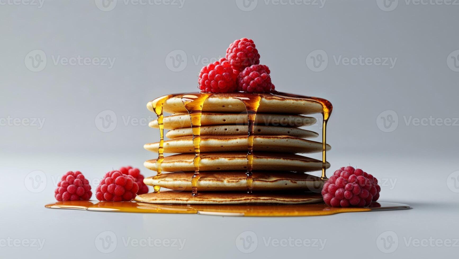 A stack of pancakes with raspberries on top photo