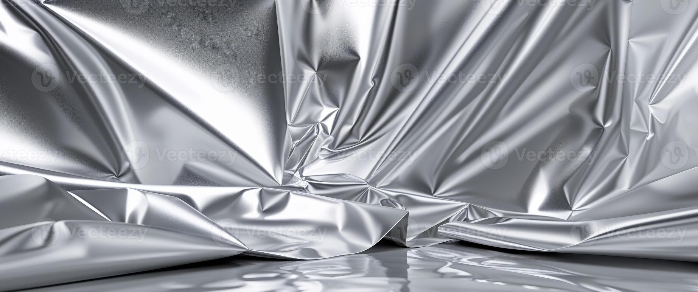 A close up of a silver fabric with a shiny surface photo