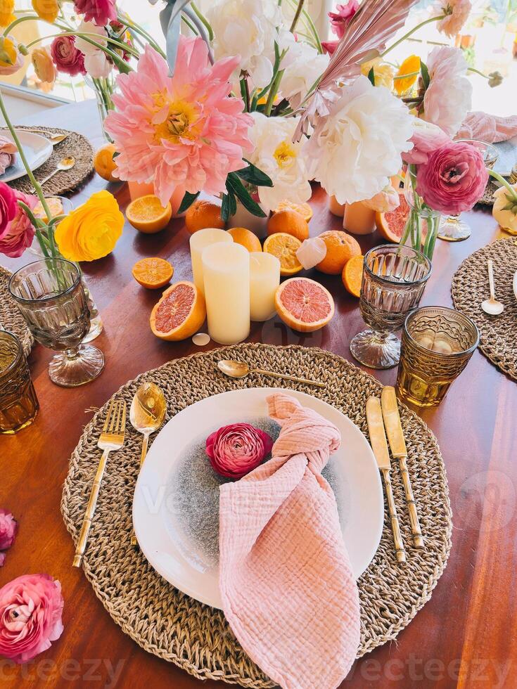 Elegant Table Setting with Flowers and Fresh Fruits photo