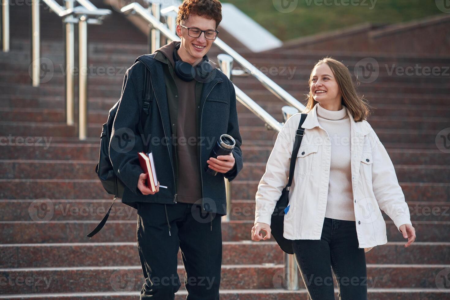 Having, a break. Two young students are together outdoors photo