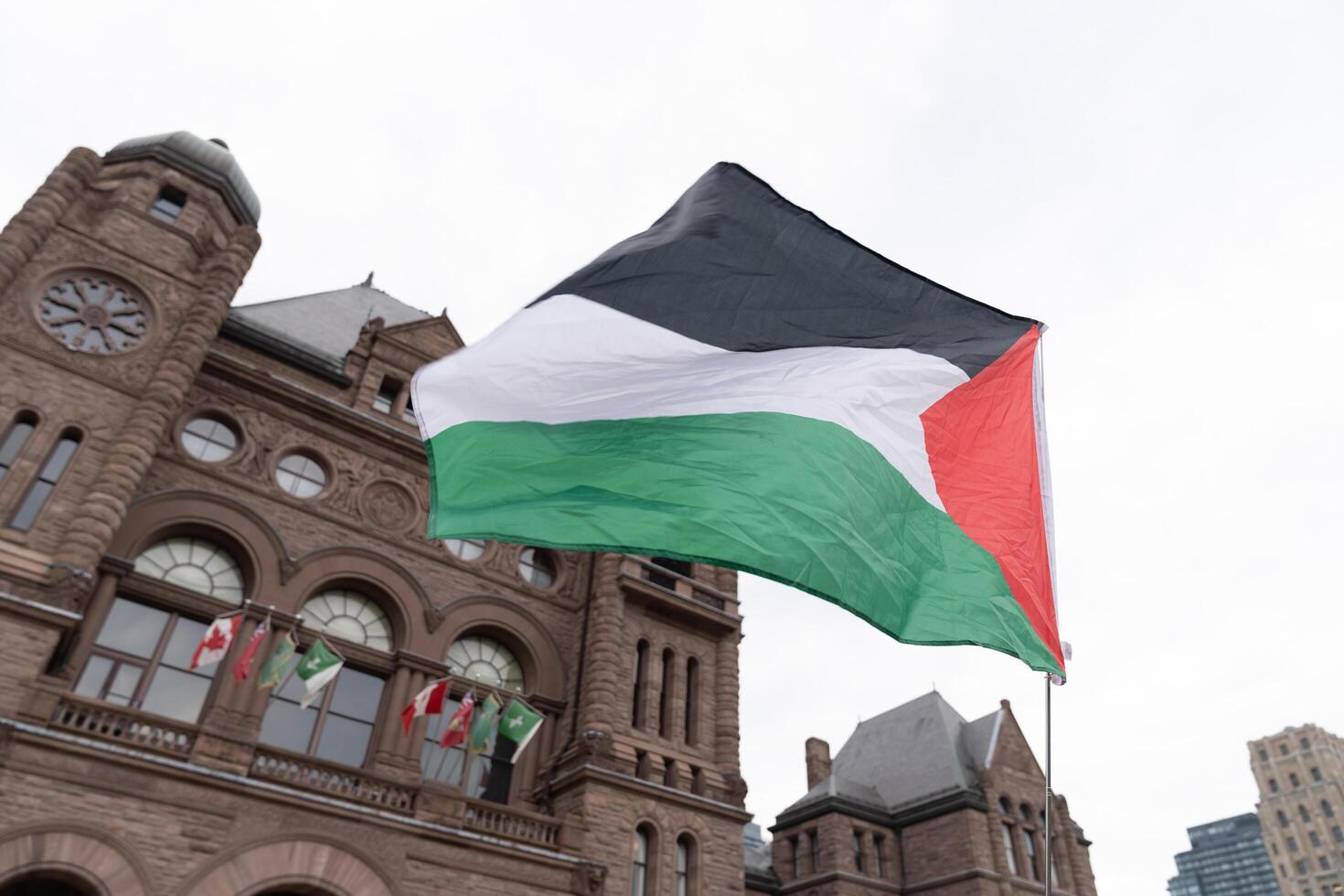 Toronto, Canada - 18 October 2023. Beneath the urban skies, heartfelt chants echo, symbolizing Toronto's collective call for peace and understanding in Palestine. photo