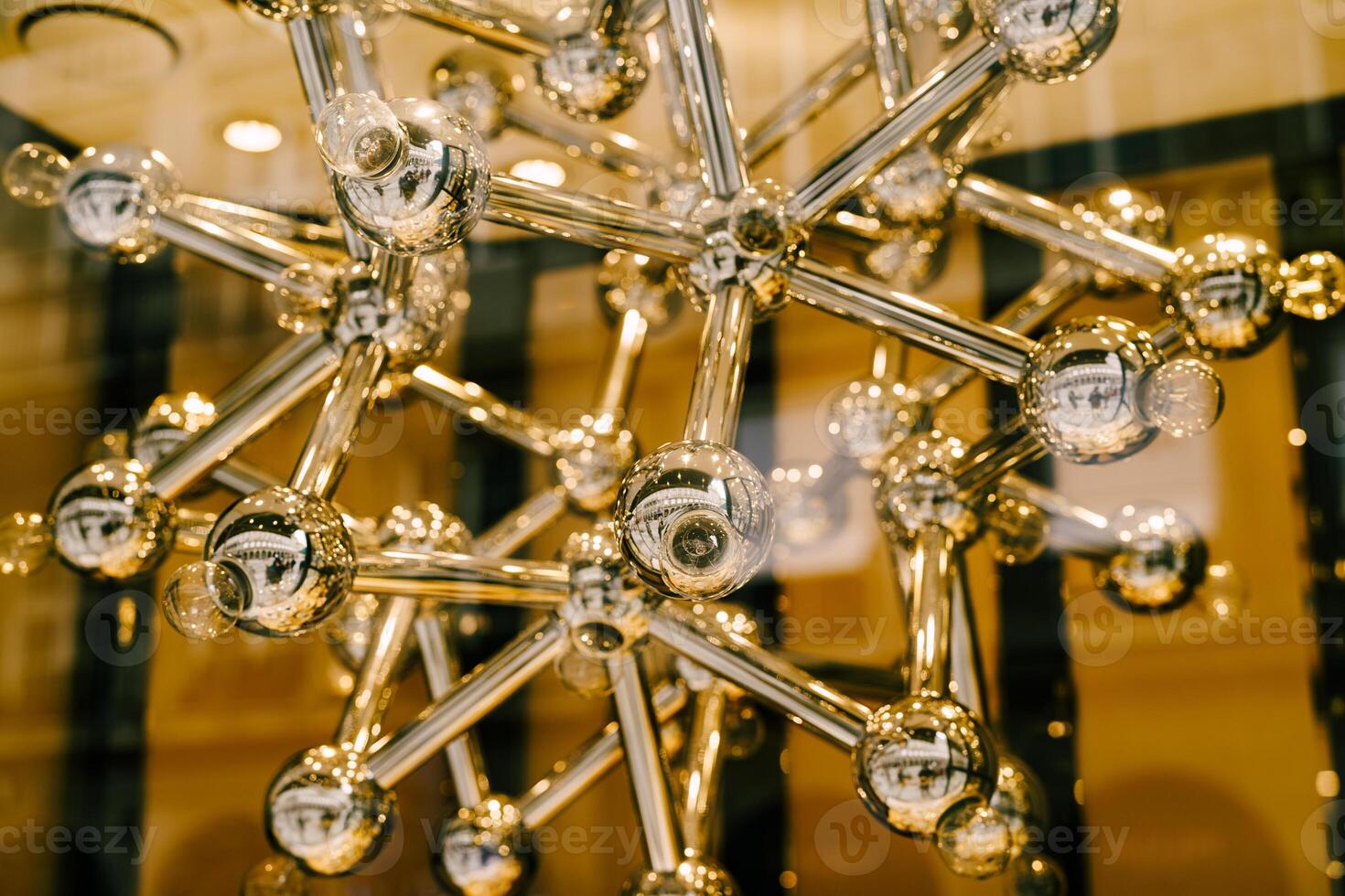 Modern Chandelier Design with Metallic Spheres and Rods photo