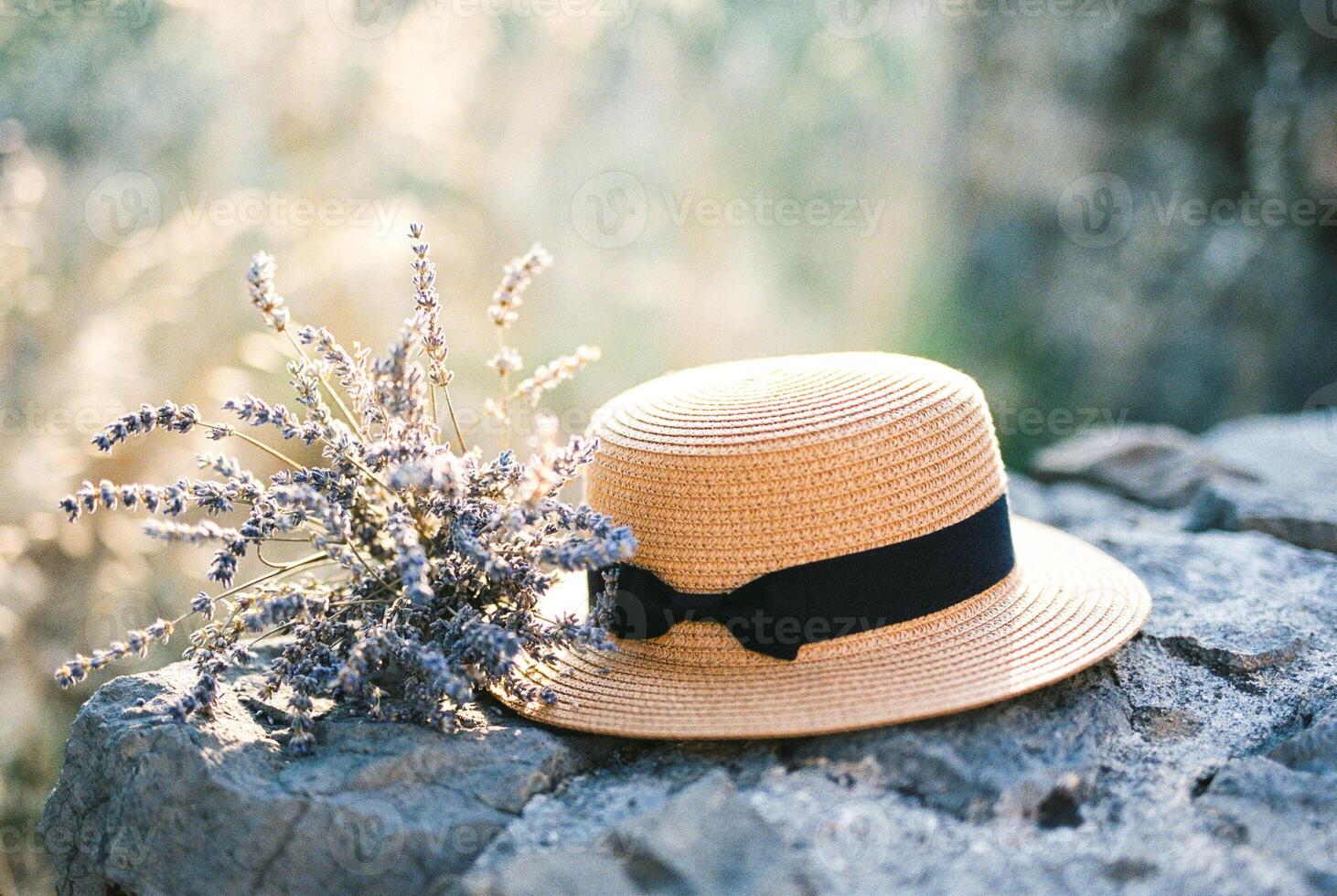 Charming Straw Hat with Lavender Bouquet in Natural Setting photo
