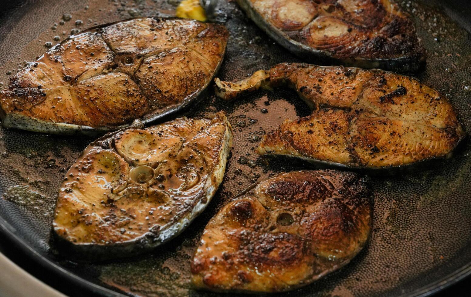grilled fish in a hot plate photo