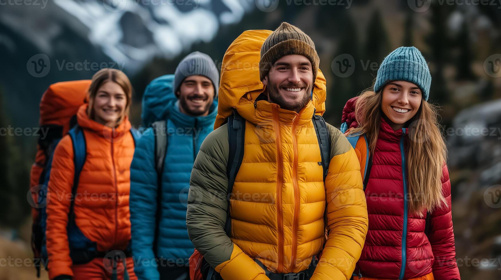 Four people in colorful jackets and hats are smiling photo