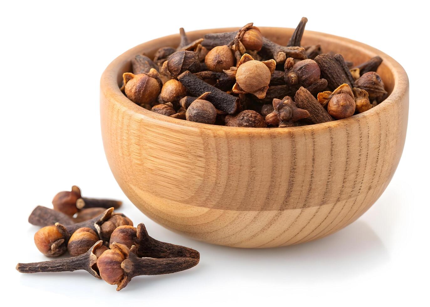 Top-Down View of Dried Cloves in a Wooden Bowl photo