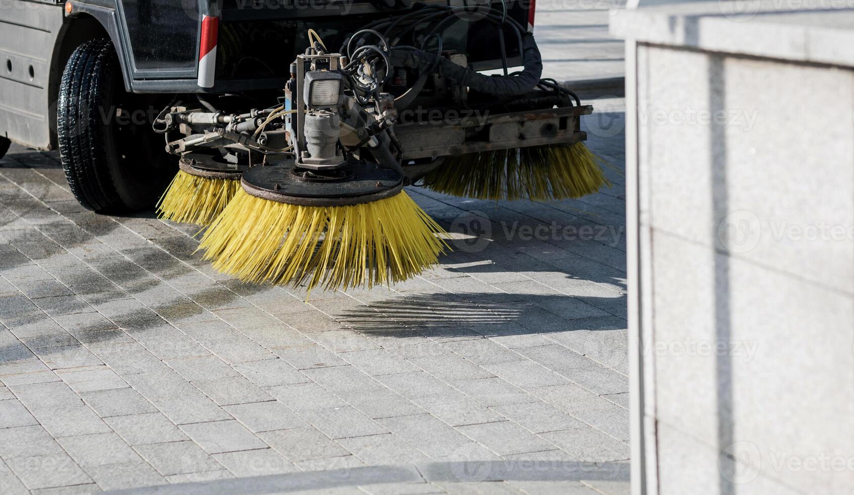 Close-up sweeper machine cleaning. photo