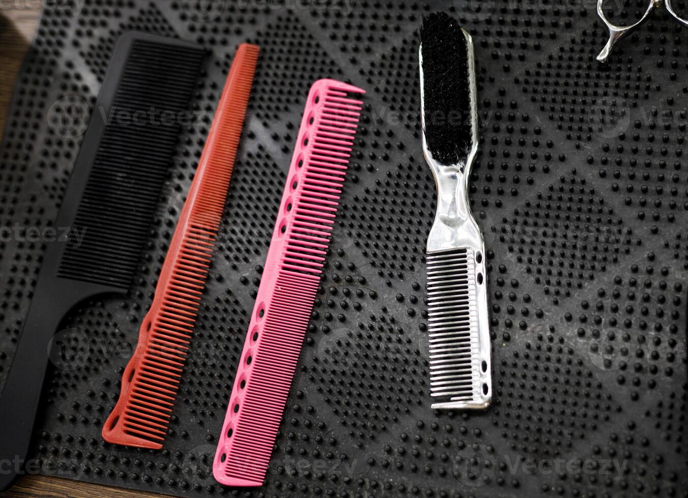 Professional combs on table of barbershop photo