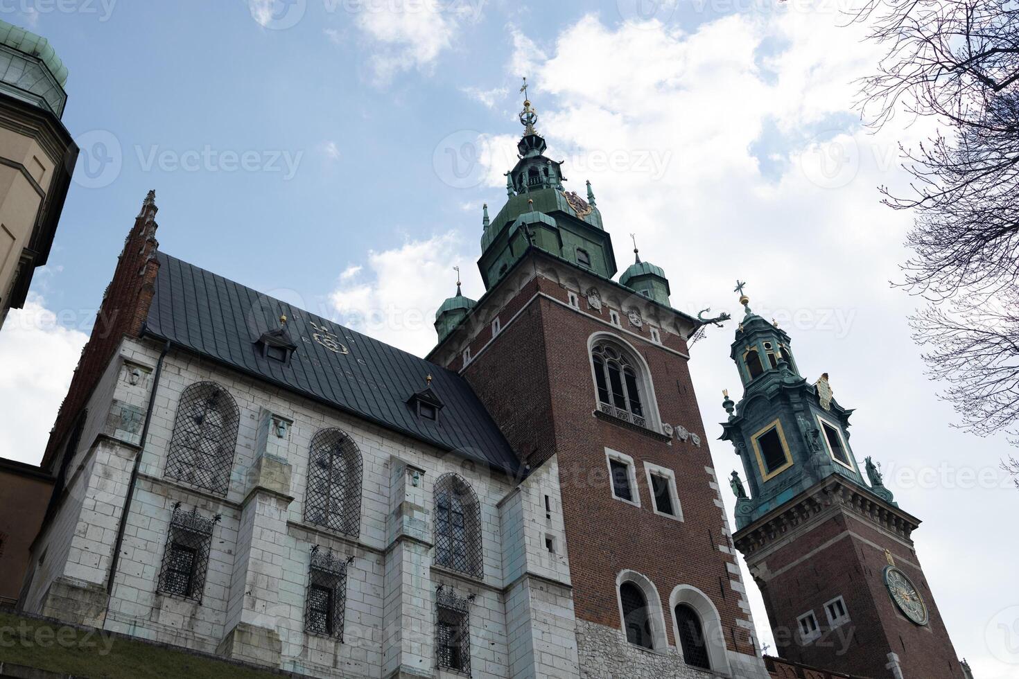 Historic Cathedral Building with Towers in Krakow, Poland, Under Clear Sky photo