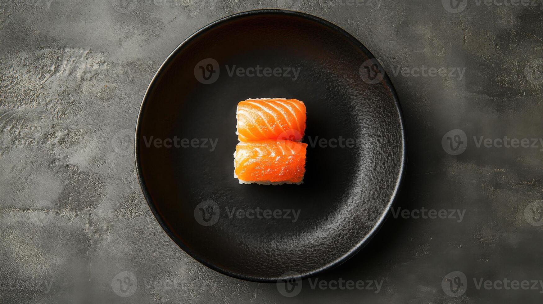 Two pieces of fresh salmon sushi stacked on a black plate. Food presentation on a dark textured background. Simple and clean aesthetic. photo