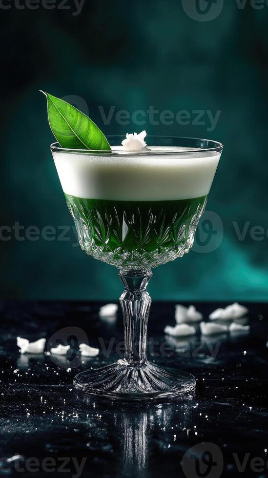 Pandan coconut milk tea with a sculptural pandan leaf garnish on a black quartz countertop photo
