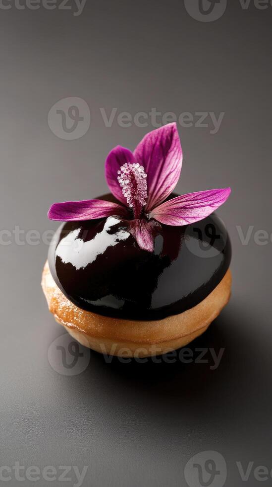 Gourmet profiterole showcasing vanilla-bean cream and tropical guava ganache with a crystallized hibiscus petal photo