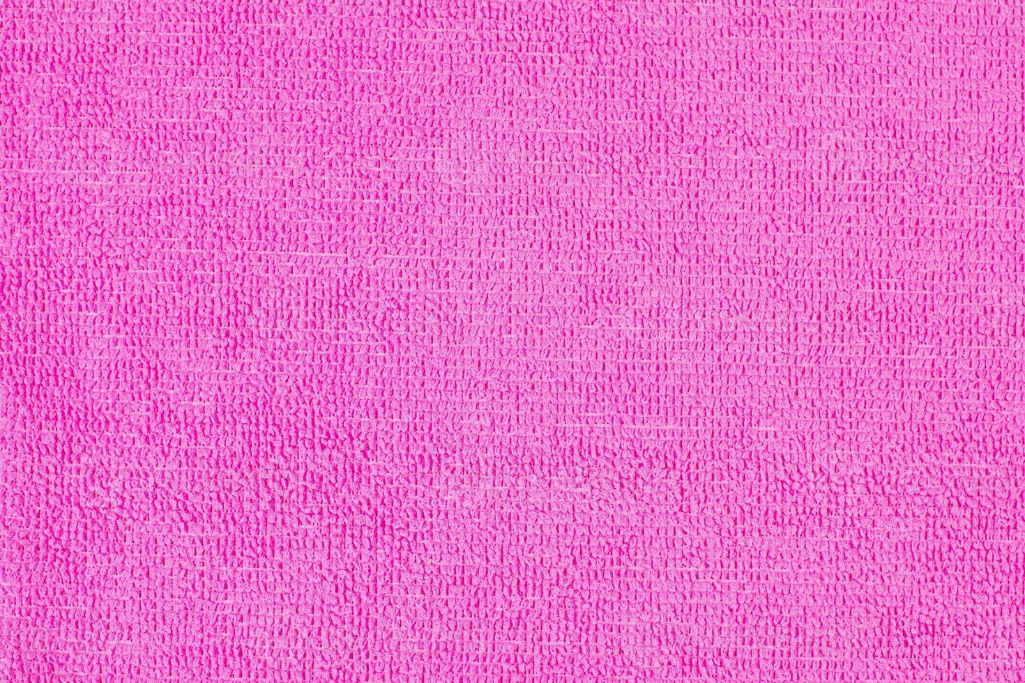 Fuchsia microfiber cloth with intricate textured loop weave that creates a soft fabric texture, ideal for wiping away dust and dirt when cleaning your home, photo