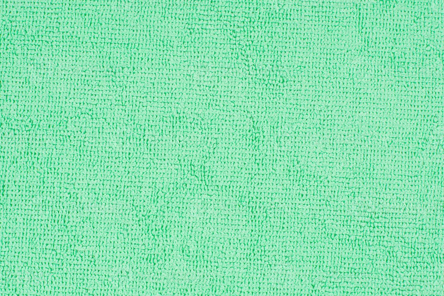 Textured surface microfiber cloth with complex loop pattern, ideal for wiping dust and dirt during delicate cleaning of the house, soft mint color photo