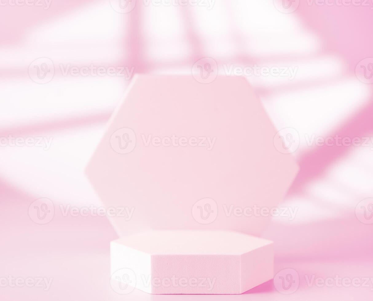 Pink podium for product presentation on abstract background photo