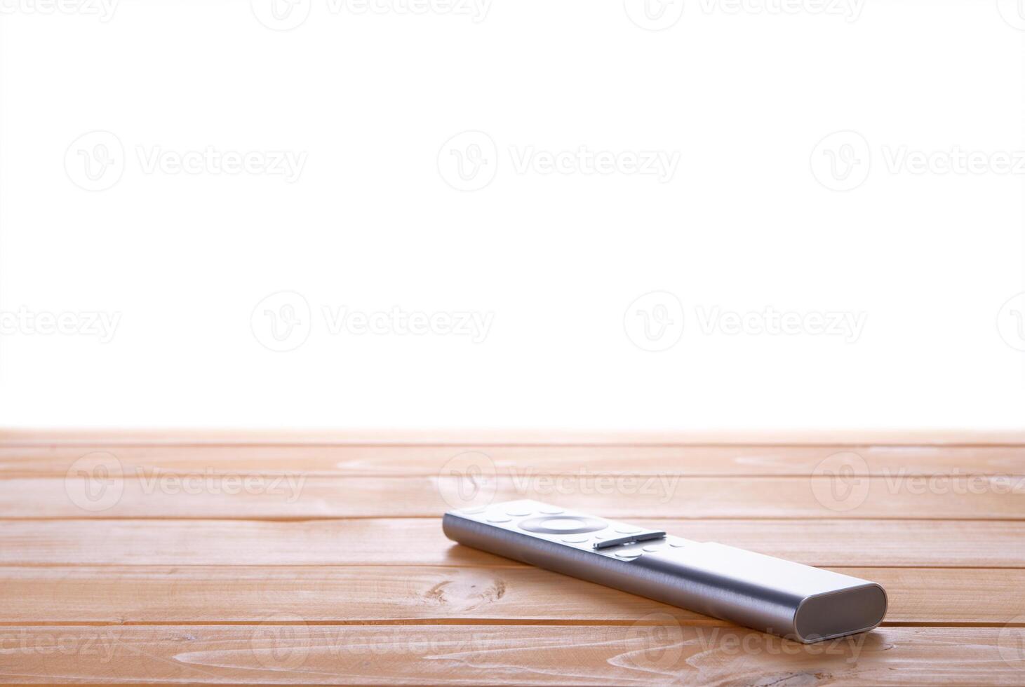 Remote control from tv on the table with isolated background photo