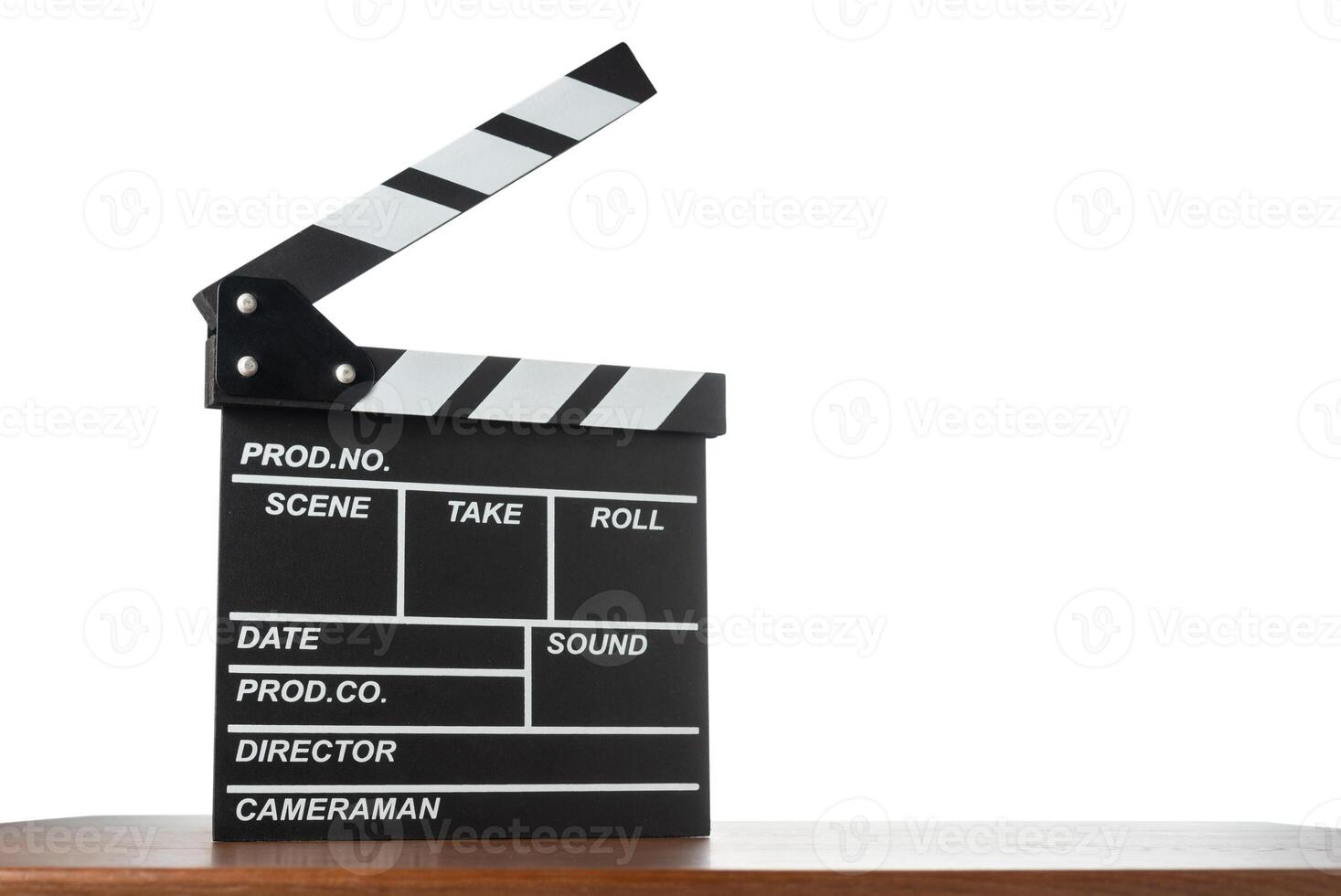 Movie clapperboard on table on white isolated background photo