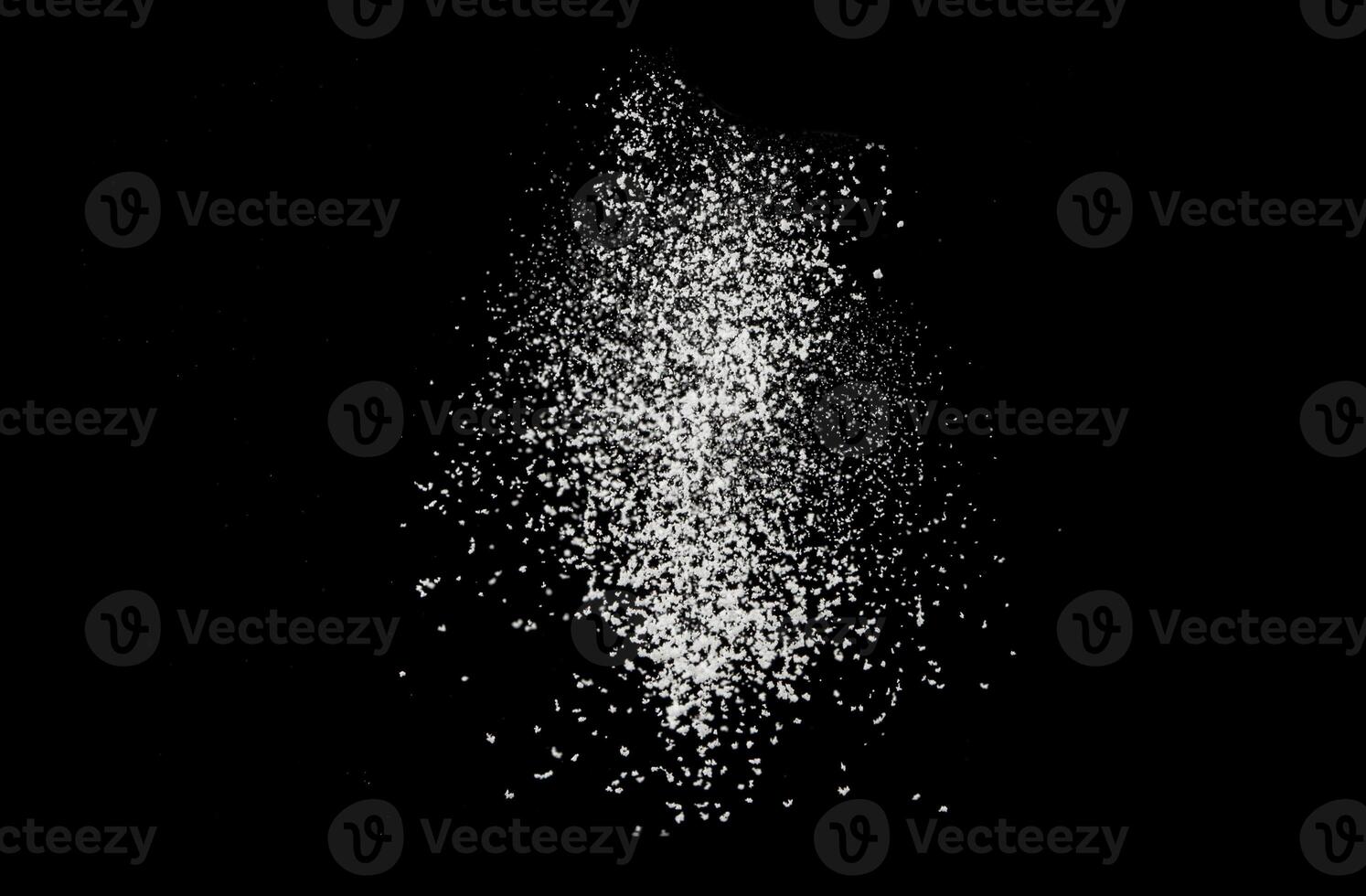 Flour texture on a black background. Flour, dust, snow falling down photo