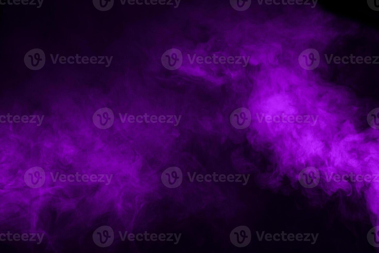 Purple smoke on a black background photo