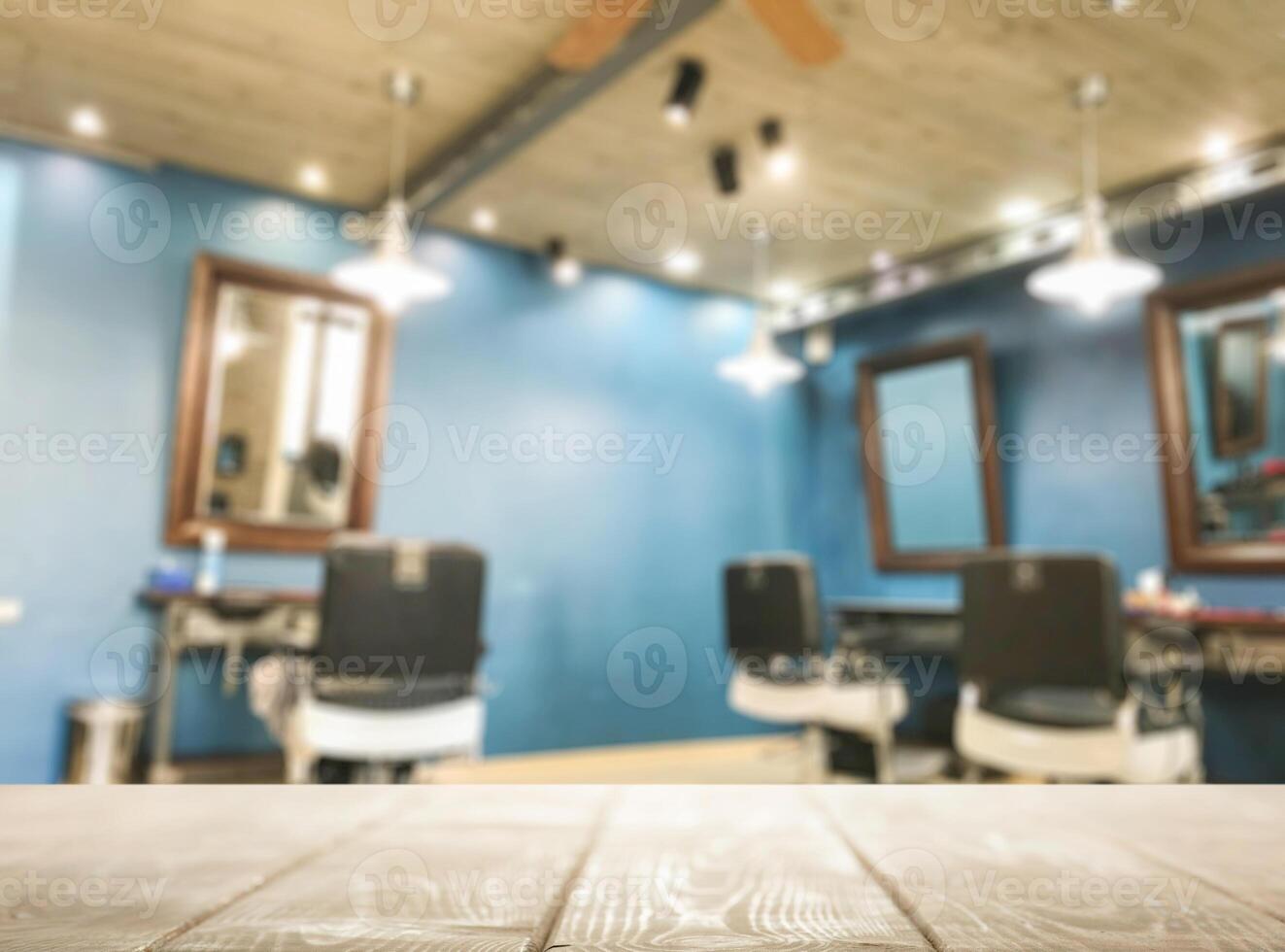 A barber chair and table in a room with blue walls photo