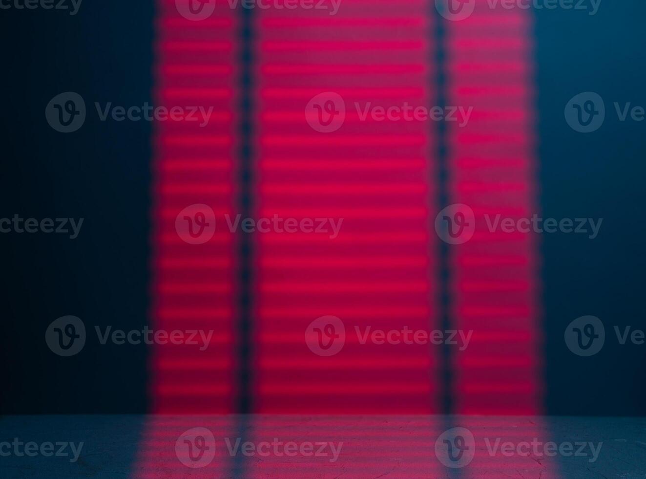Red Light passing through the blinds and falling on the wall photo