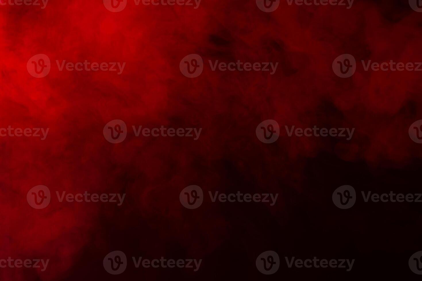 red smoke on black background photo
