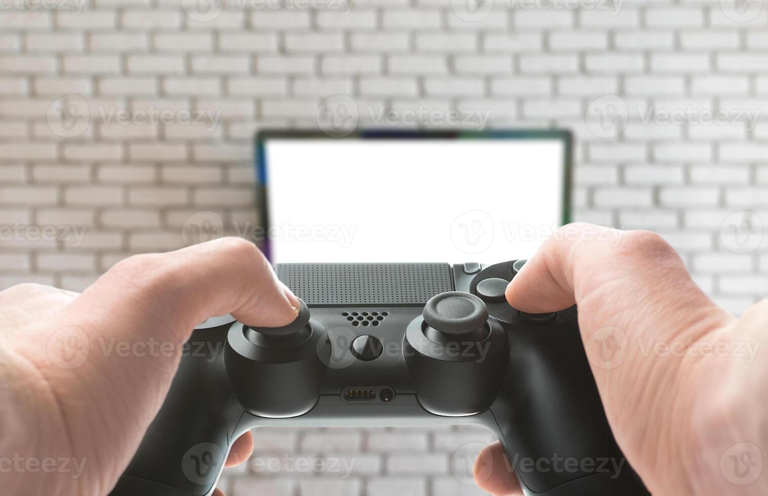 Gamepad in hand with tv on background photo