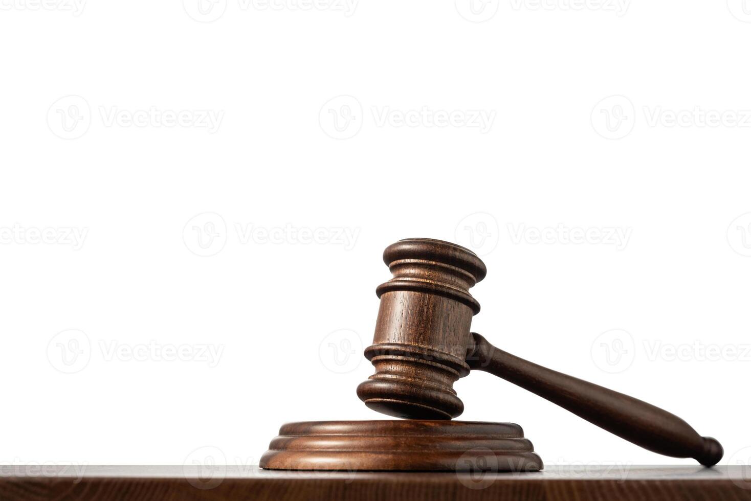Judge's gavel on a wooden table photo