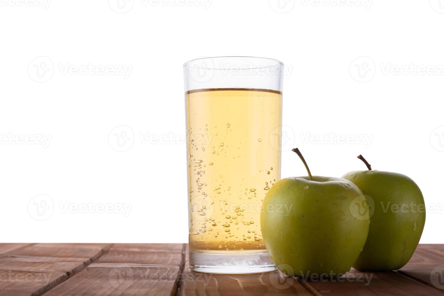 Apple juice on a table with isolated background photo
