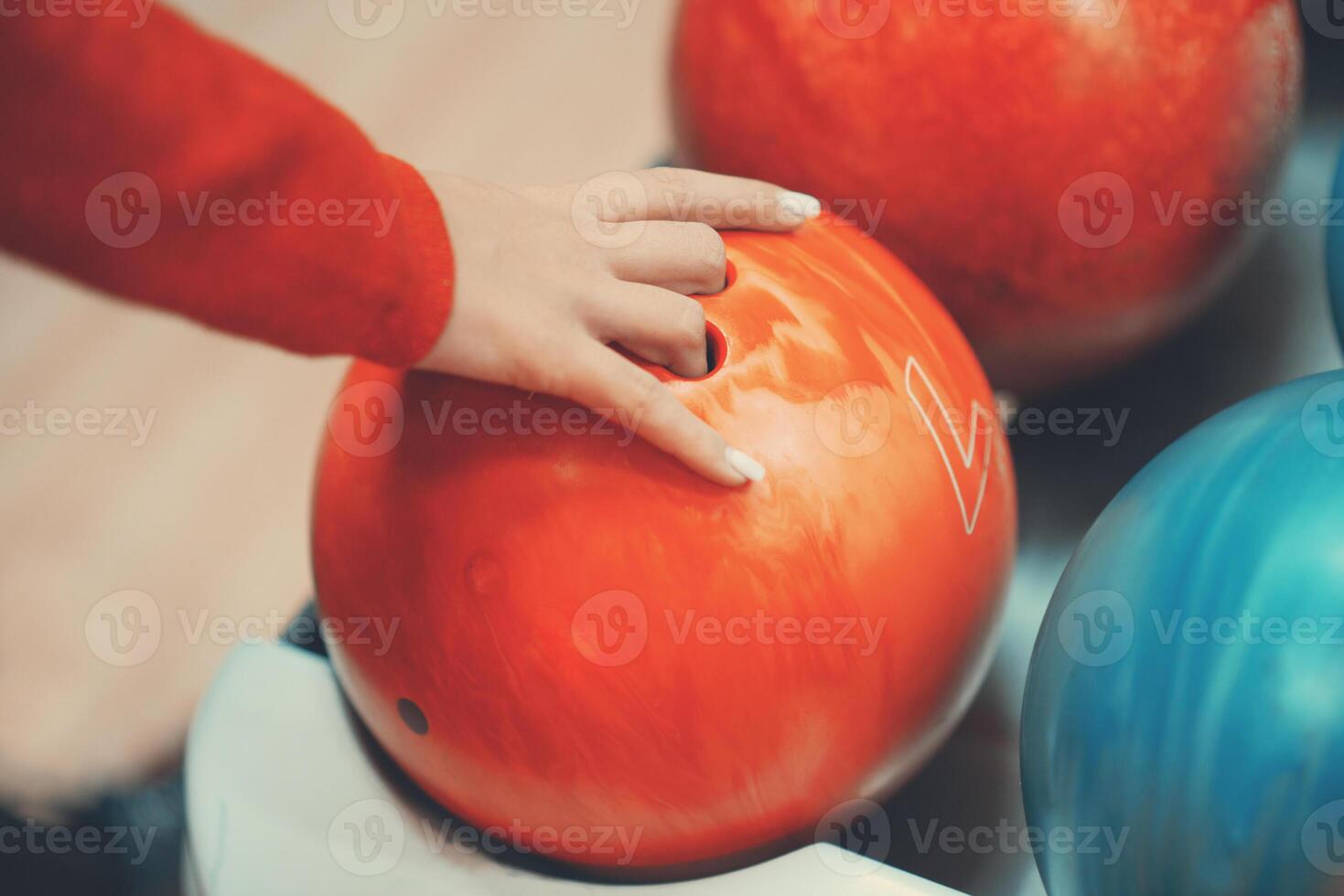 Female hand and bowling ball photo