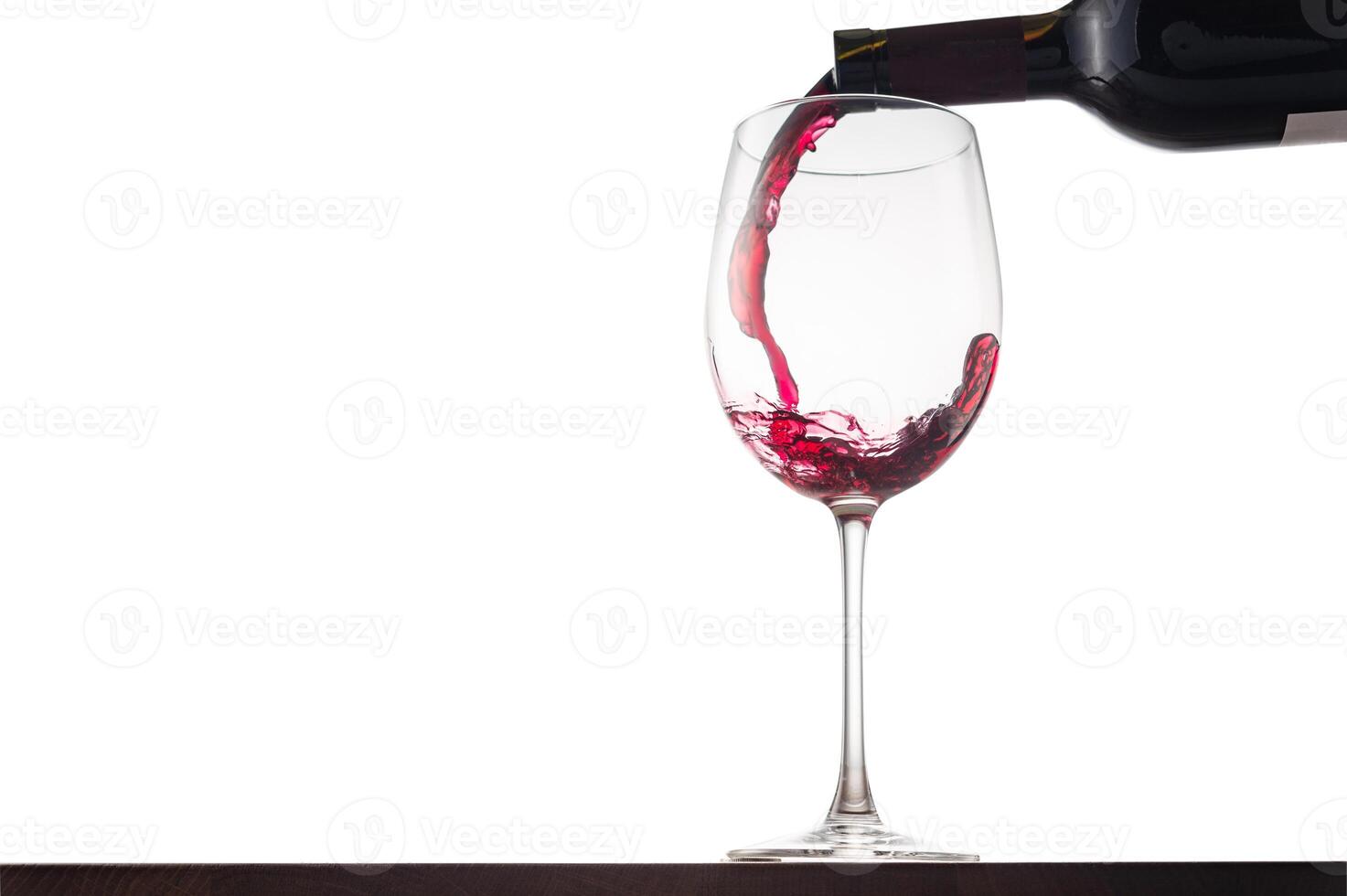 Pouring wine into a glass photo
