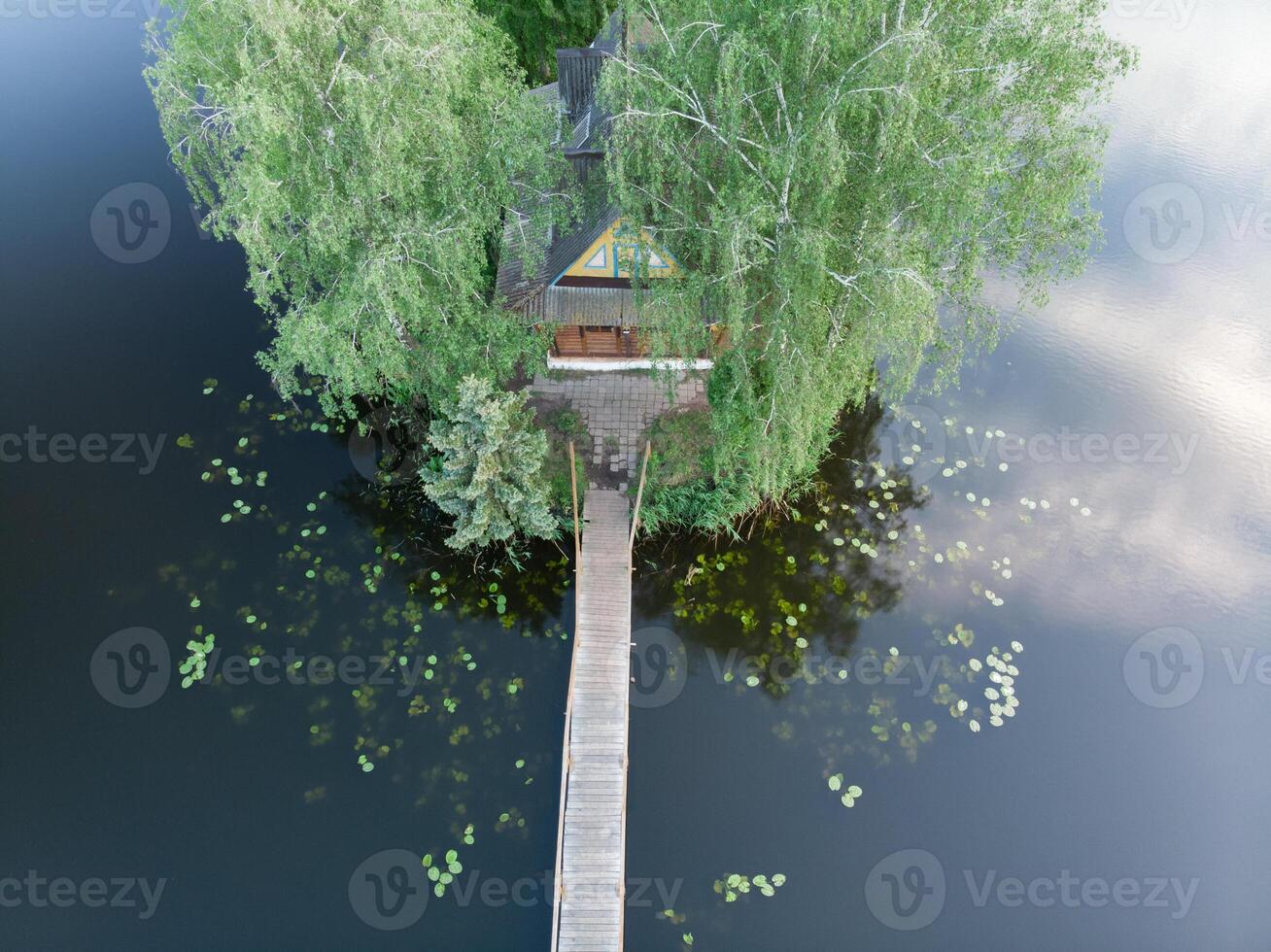 A small fisherman's house in the middle of the river photo