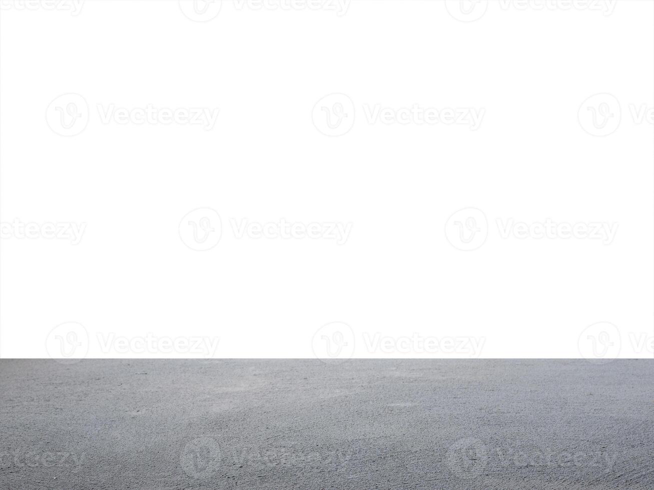 A white wall and a concrete floor photo