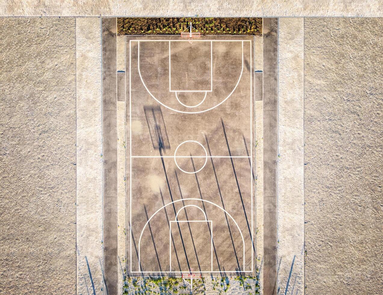 A basketball court with a basketball hoop and a net photo