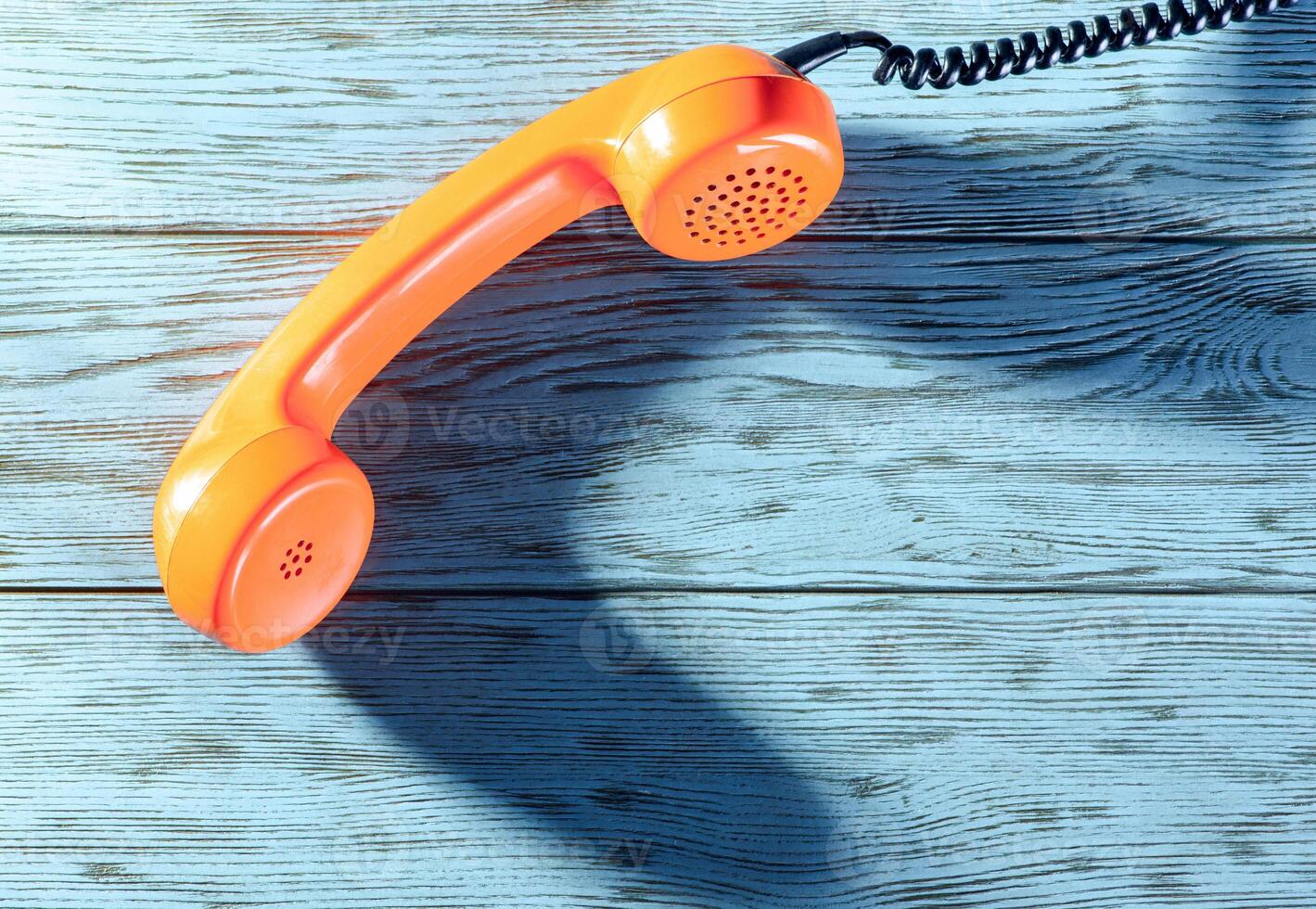 The handset on the table top view photo