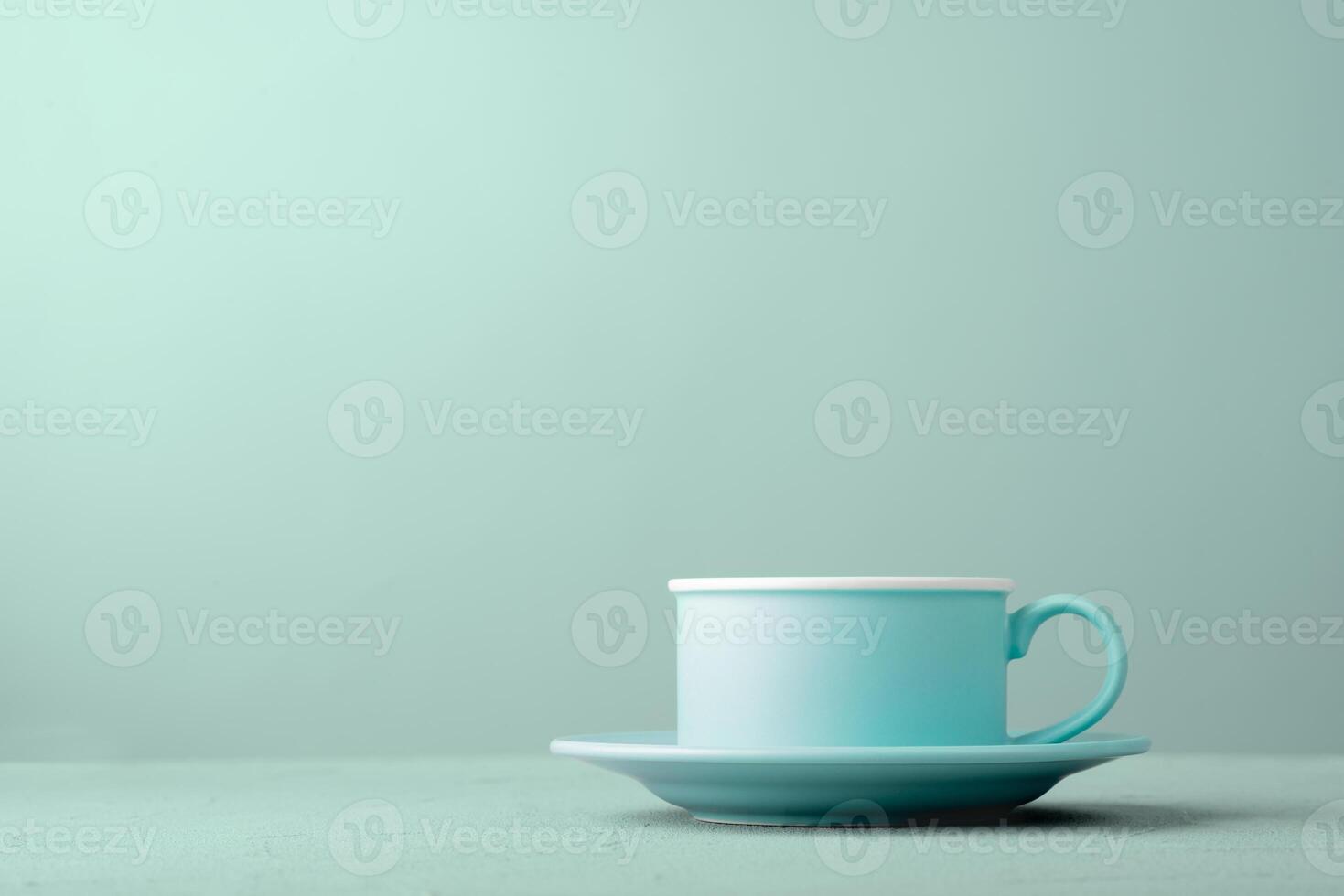 Turquoise cup on the table photo