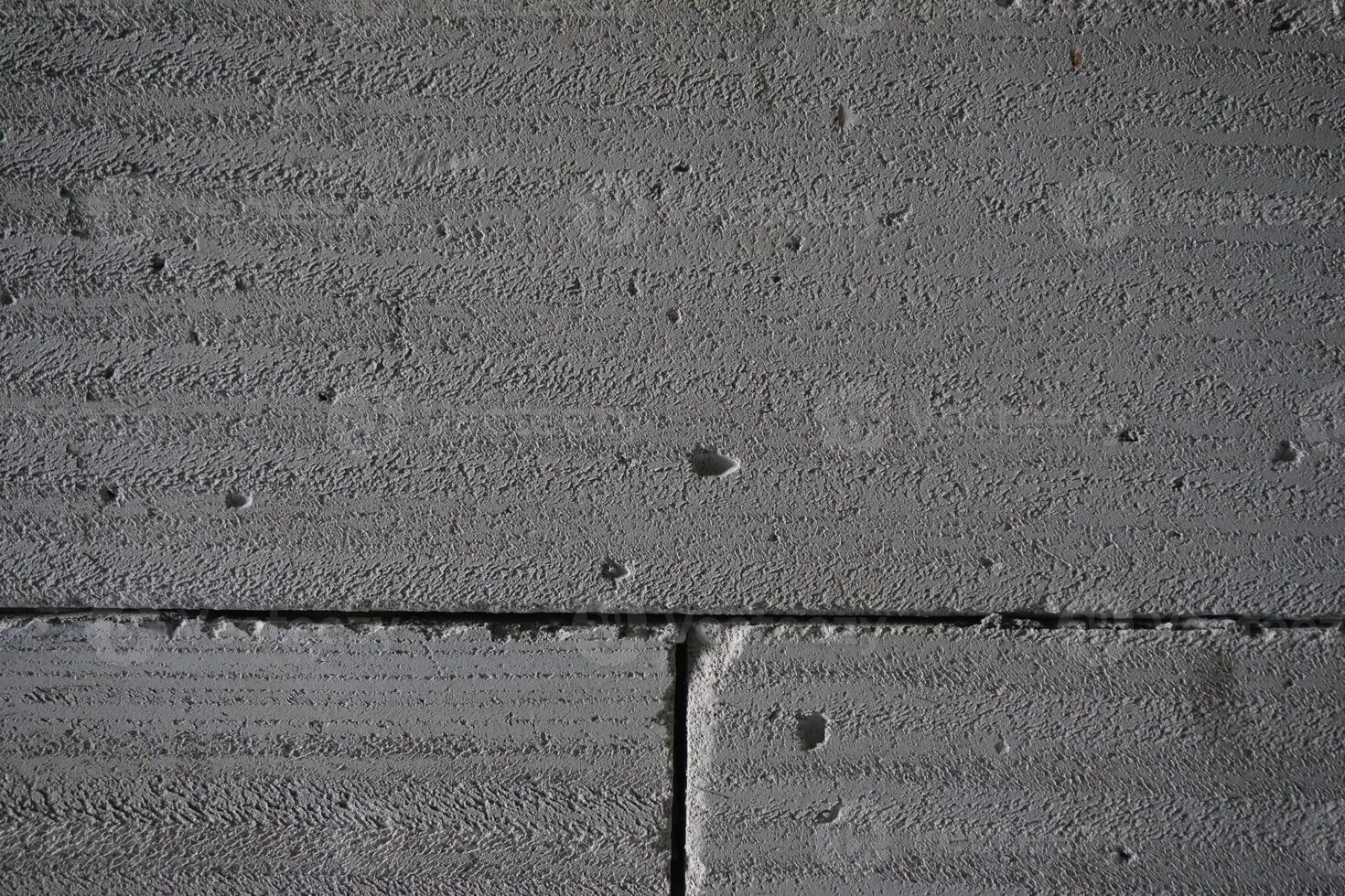 Grey concrete blocks wall texture background photo