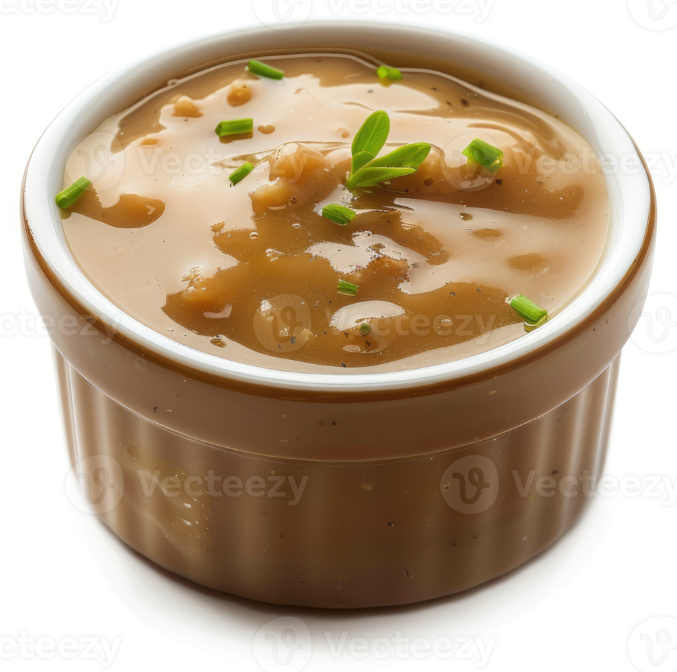 Close up of a rich, savory gravy in a small bowl. png