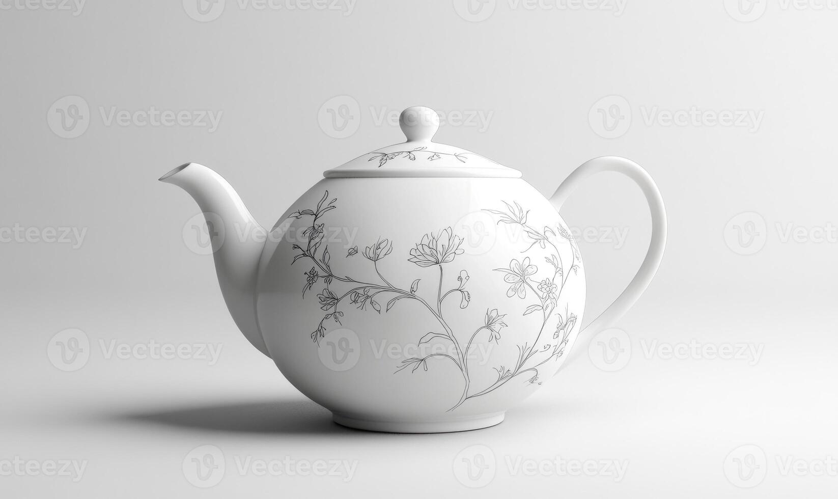 a white teapot with a floral design on it photo